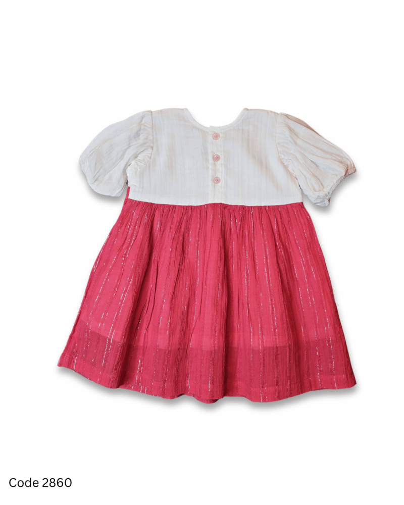 Pink and white girl dress with short sleeves, shimmery lines and back button closure.