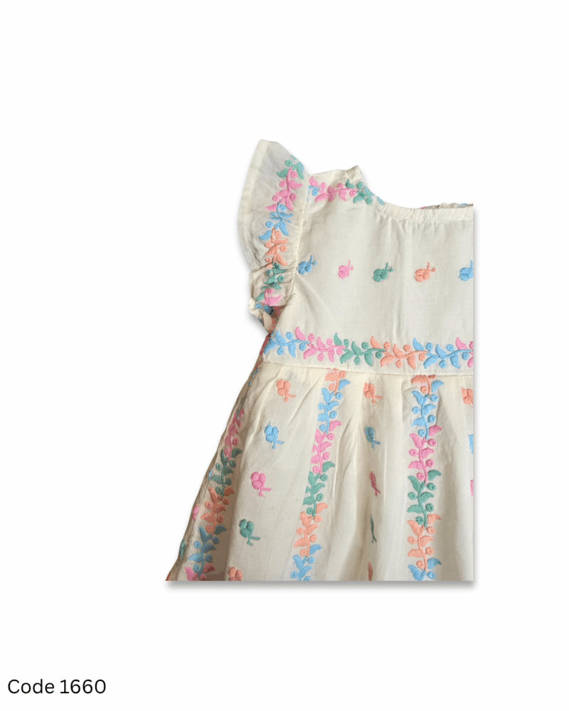 White sleeveless girl dress with flutter sleeves, full embroidery, soft inner lining, and back zip closure