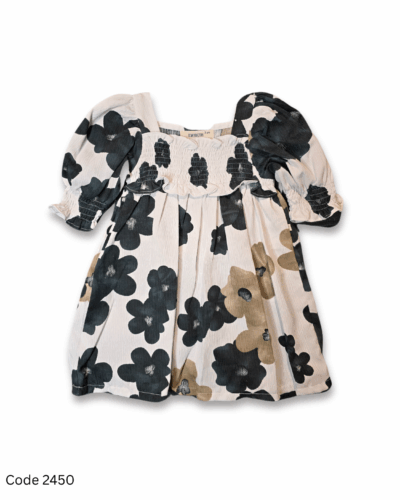 Off-white toddler dress with black and brown floral prints, elastic long sleeves, and elastic yoke